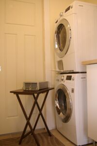 My condensing dryer has no exhaust vent but instead uses a heat exchanger to turn vapor from the clothes into water that is drained. The heat exchanger has been removed and placed on the table.